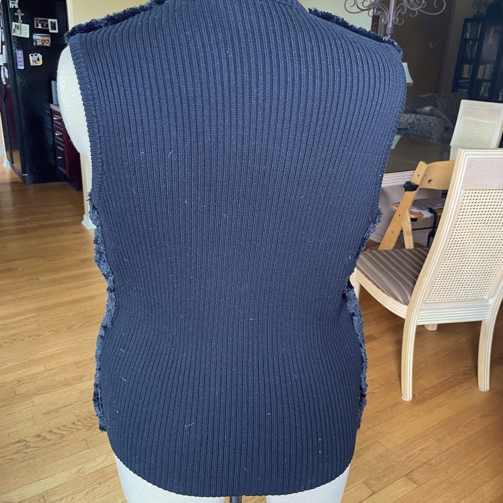 Fur front, sweater back zip vest.